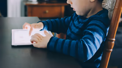 A kid using a tablet